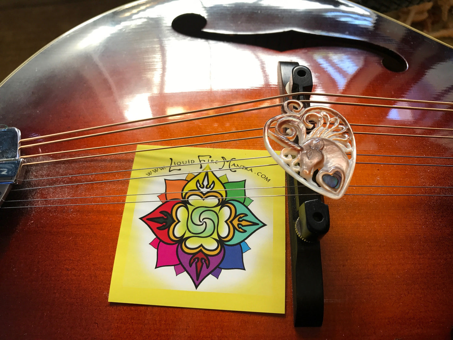 Unicorn Guitar Pick Pendant - Dark Mother of Pearl Liquid Fire Mantra