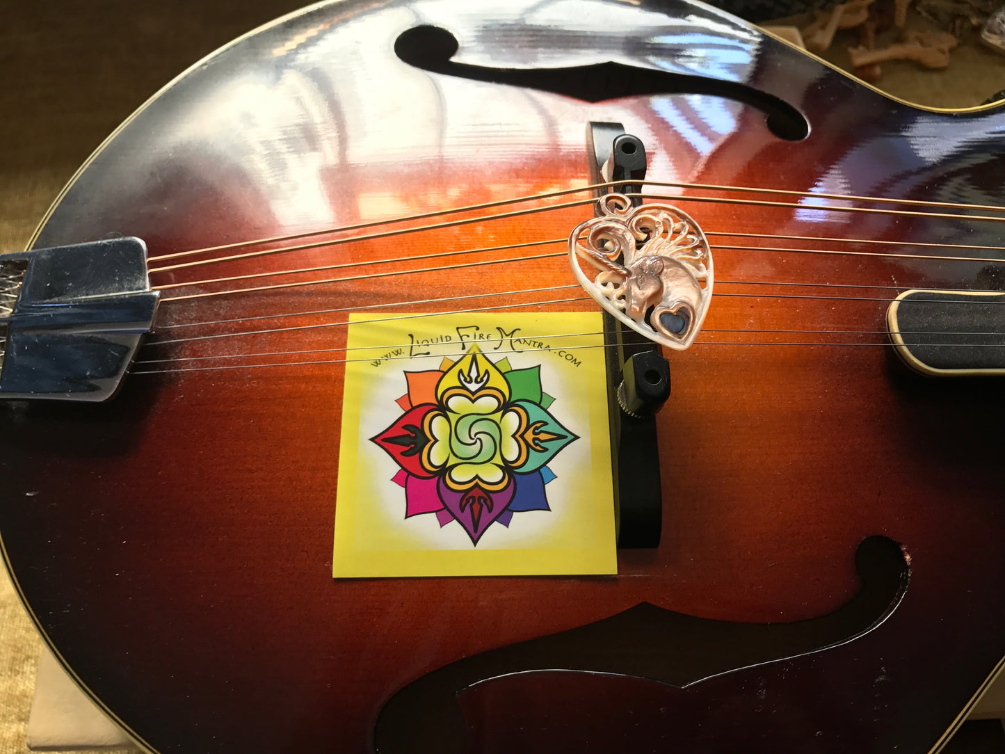 Unicorn Guitar Pick Pendant - Dark Mother of Pearl Liquid Fire Mantra